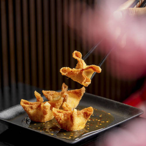 Hand folded crab wonton, a brand signature